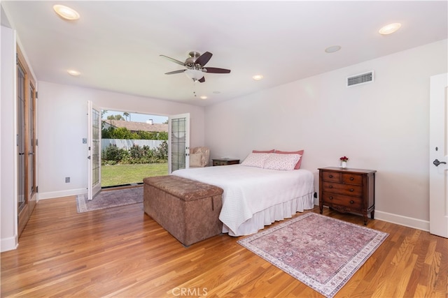 bedroom featuring ceiling fan, light hardwood / wood-style floors, and access to outside