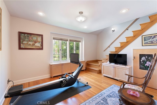 exercise area featuring light wood-type flooring