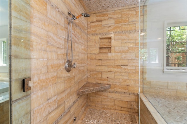 bathroom with tiled shower