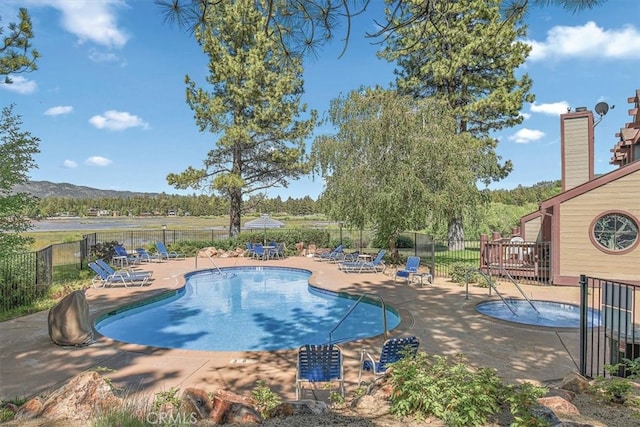 711 Cienega Rd Unit B, Big Bear Lake, CA 92315 - view of swimming pool with a mountain view and a patio