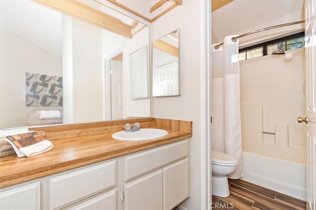 711 Cienega Rd Unit B, Big Bear Lake, CA 92315 - full bathroom featuring vanity, hardwood / wood-style flooring, toilet, and shower / bathtub combination with curtain