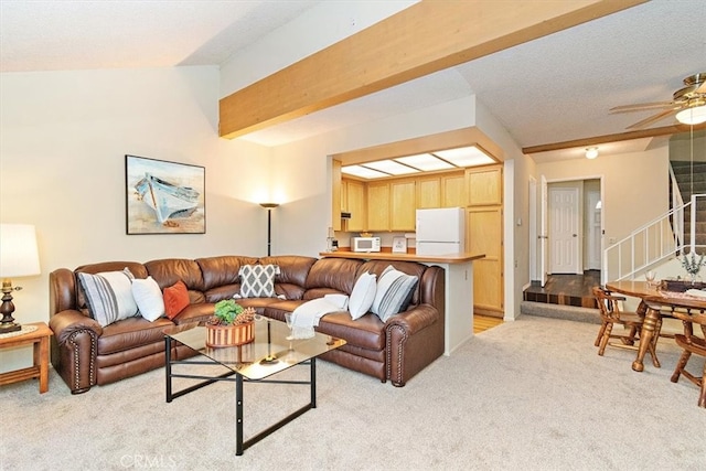 711 Cienega Rd Unit B, Big Bear Lake, CA 92315 - carpeted living room with vaulted ceiling with beams and ceiling fan