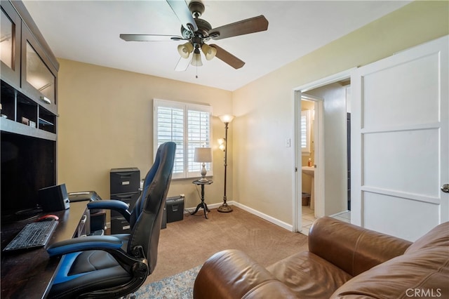 home office featuring light colored carpet and ceiling fan