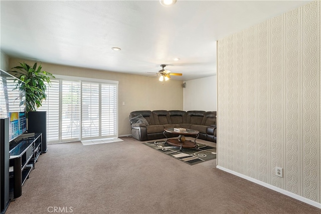 living room with carpet flooring and ceiling fan