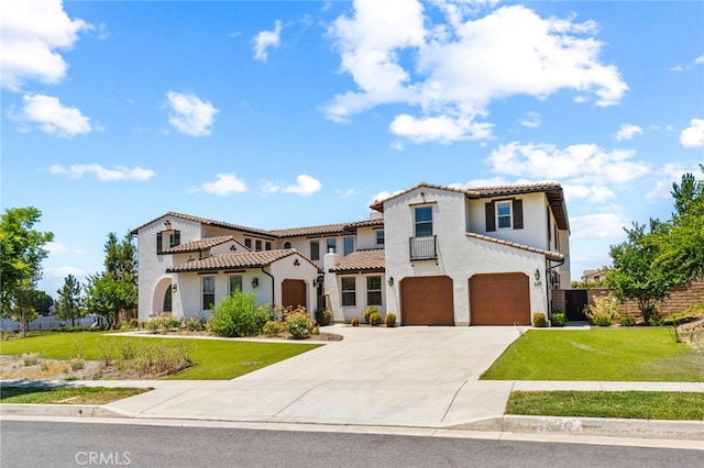 mediterranean / spanish-style home featuring a garage and a front lawn