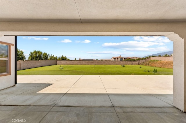 view of patio / terrace featuring a mountain view