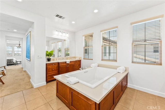 full bath featuring tile patterned flooring, a wealth of natural light, ensuite bathroom, and visible vents