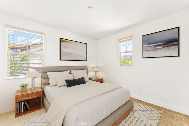 bedroom with light carpet