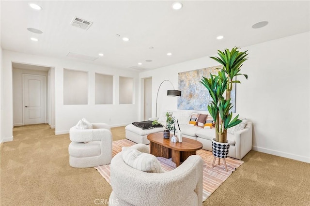 living room with visible vents, light carpet, and recessed lighting