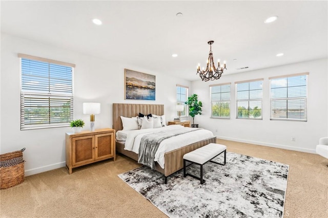 bedroom with light colored carpet, baseboards, a chandelier, and recessed lighting