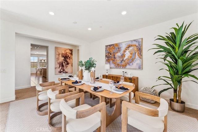 carpeted dining room with baseboards and recessed lighting