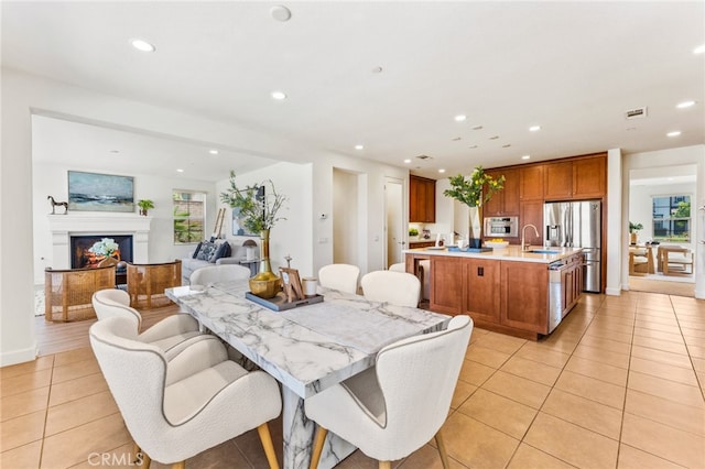 tiled dining area featuring sink