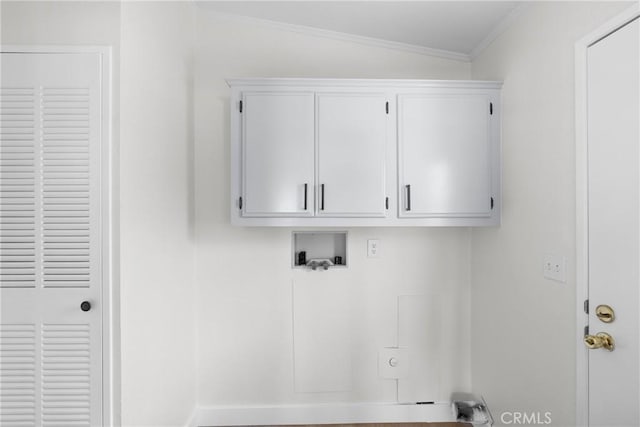 laundry area featuring ornamental molding, washer hookup, and cabinet space