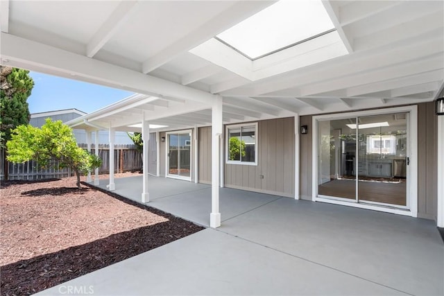 view of patio featuring fence