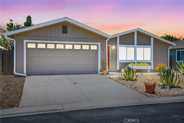 view of front of house with a garage and driveway