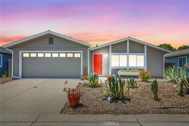 view of front of property featuring driveway and an attached garage