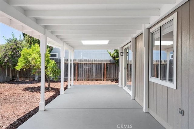 view of patio / terrace featuring fence