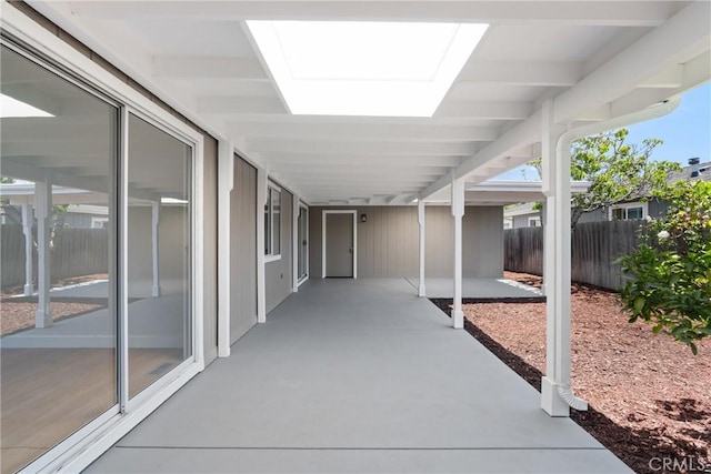 view of patio featuring fence