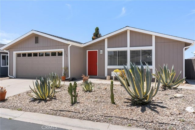 view of front of property with driveway and an attached garage