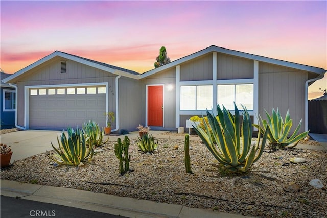 view of front facade featuring an attached garage and concrete driveway