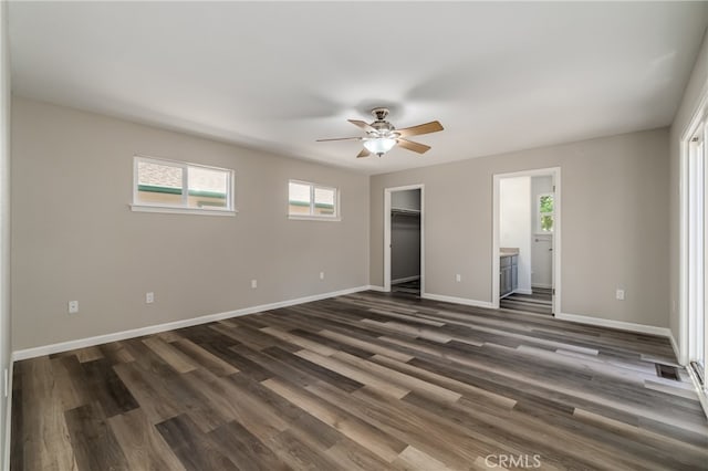 empty room featuring ceiling fan and dark hardwood / wood-style floors