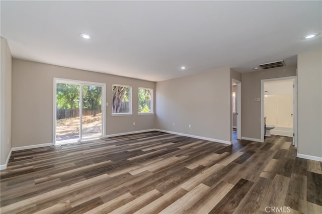 unfurnished room featuring dark wood-type flooring