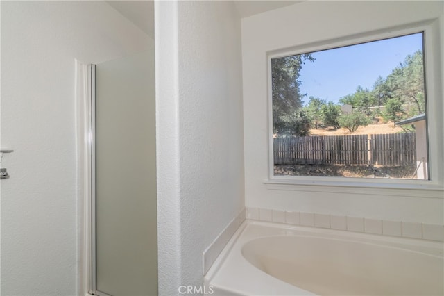 bathroom with independent shower and bath