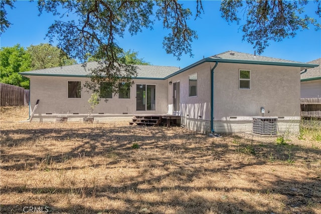 rear view of house with central AC