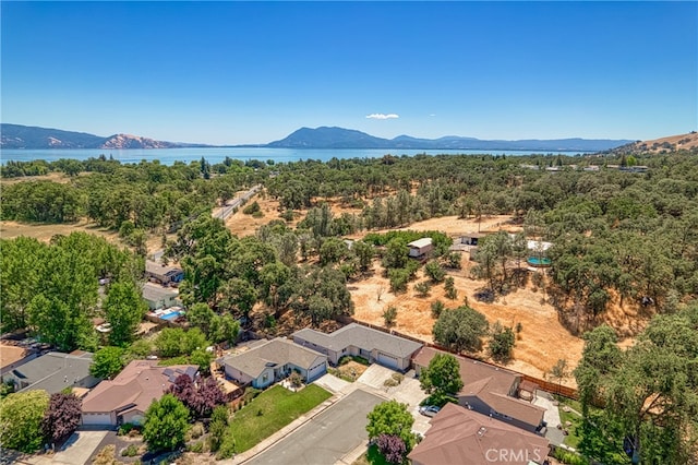 birds eye view of property with a mountain view