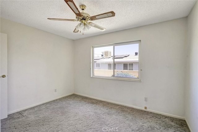 carpeted empty room with a textured ceiling and ceiling fan