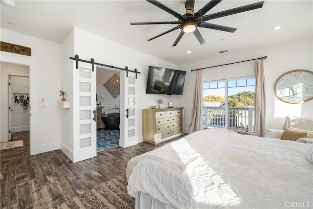 bedroom with ceiling fan, dark hardwood / wood-style floors, access to outside, and a barn door