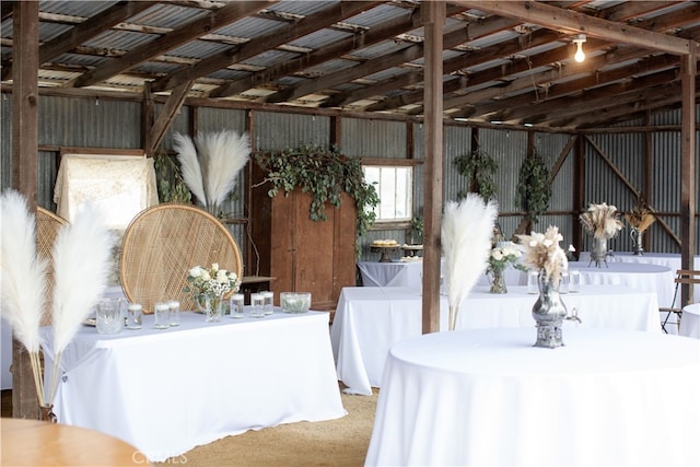 interior space featuring lofted ceiling and carpet