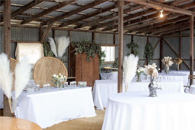 interior space featuring carpet flooring and vaulted ceiling