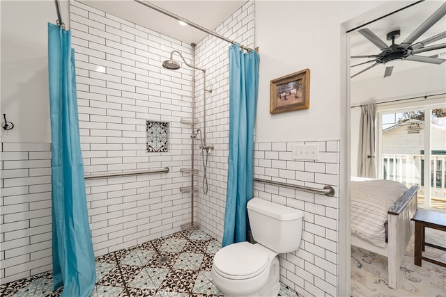 bathroom featuring tile walls, a shower with curtain, toilet, and ceiling fan