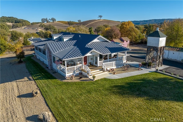 drone / aerial view featuring a mountain view