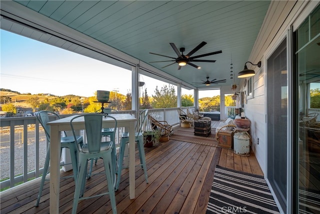 wooden deck with ceiling fan