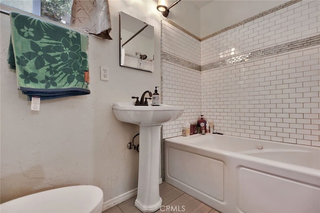 bathroom with a bathing tub and toilet