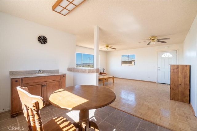 50471 Cholla Rd, Johnson Valley, CA 92285 - dining area featuring a textured ceiling, baseboards, and ceiling fan