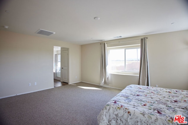 bedroom featuring light colored carpet