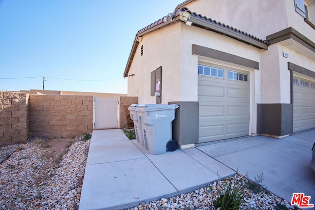 view of property exterior featuring a garage