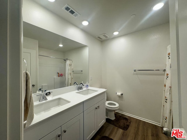 bathroom with vanity, a shower with shower curtain, wood-type flooring, and toilet