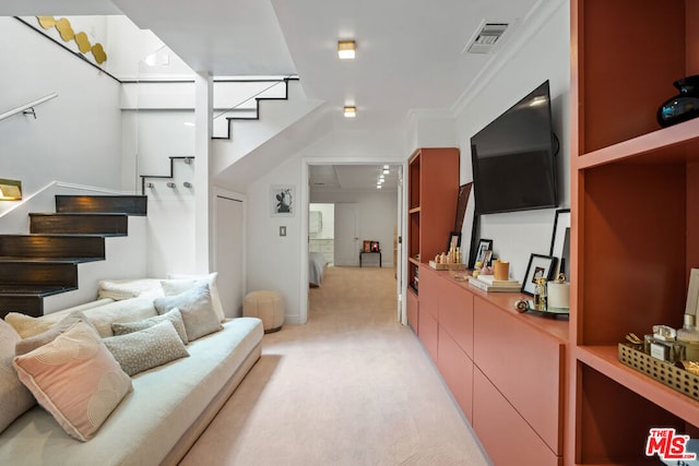 living room featuring light colored carpet and ornamental molding