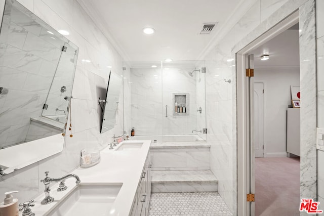 bathroom featuring crown molding, vanity, and tiled shower / bath combo