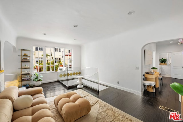 living room with dark wood-type flooring