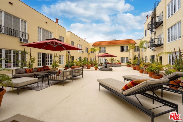 view of home's community featuring a patio area and an outdoor hangout area