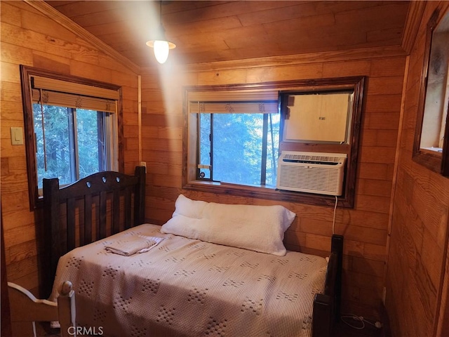 bedroom featuring vaulted ceiling, wood walls, and cooling unit