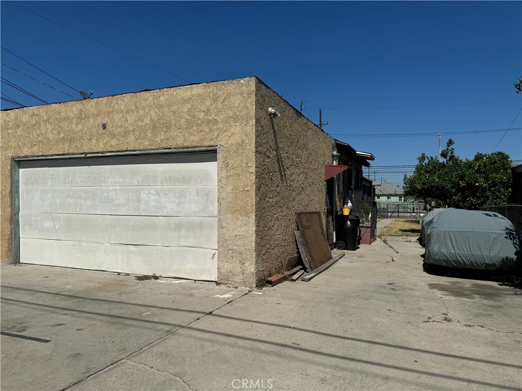 view of side of home with a garage