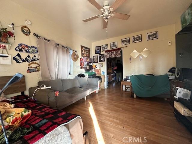 bedroom featuring ceiling fan and hardwood / wood-style flooring