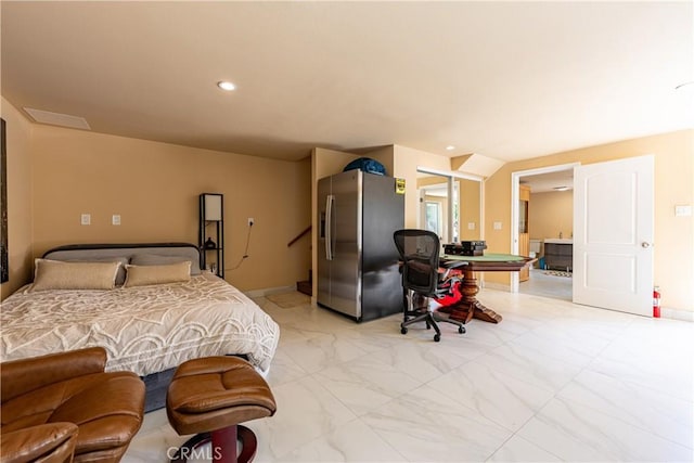 bedroom with stainless steel fridge