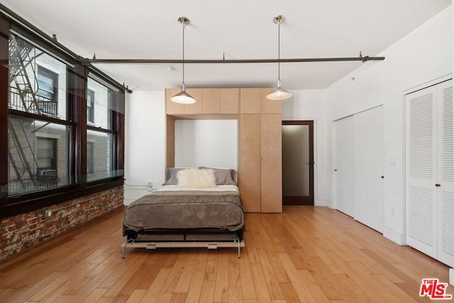 bedroom with light hardwood / wood-style floors